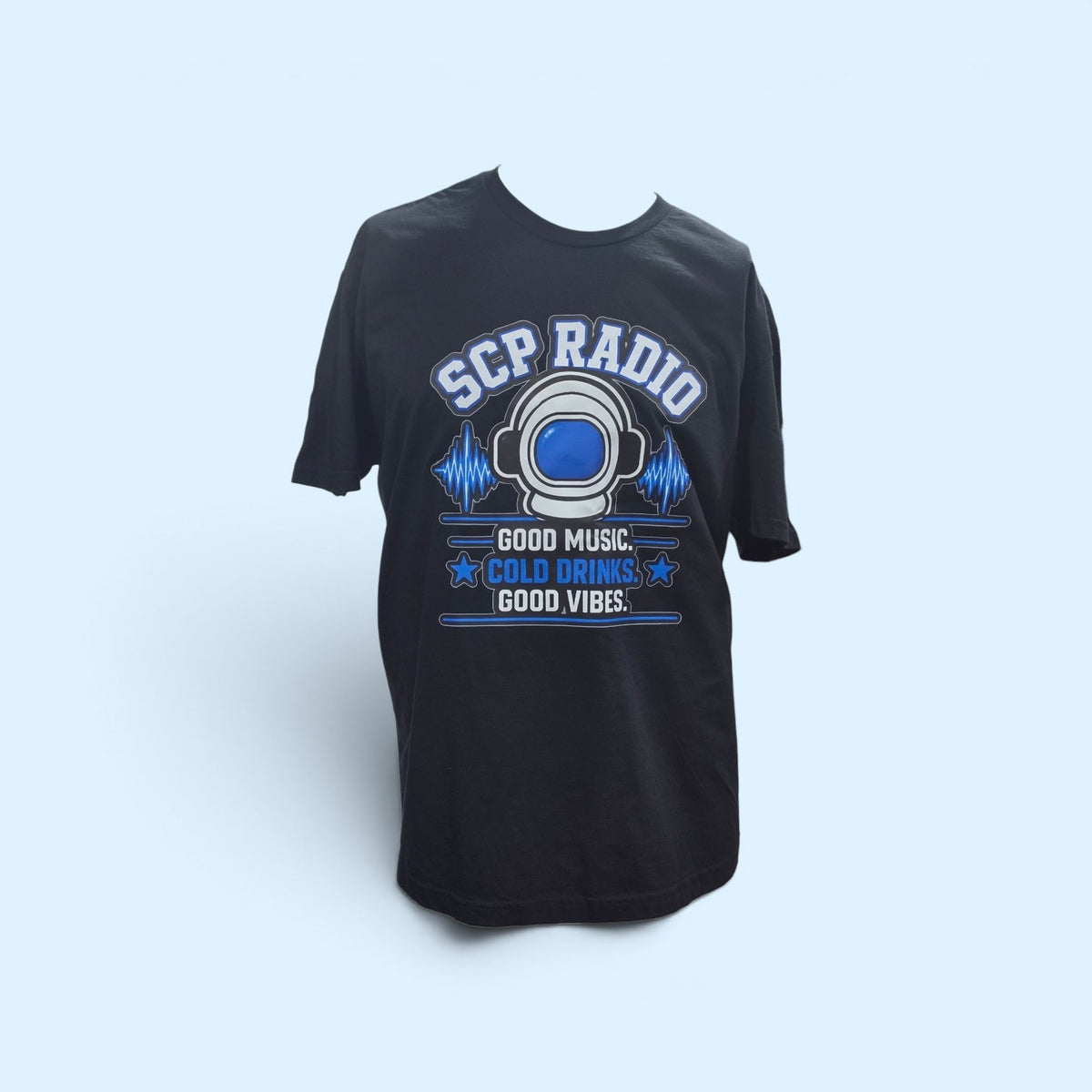 SCP Apparel black cotton crewneck t-shirt featuring a retro astronaut helmet graphic with blue sound wave accents.