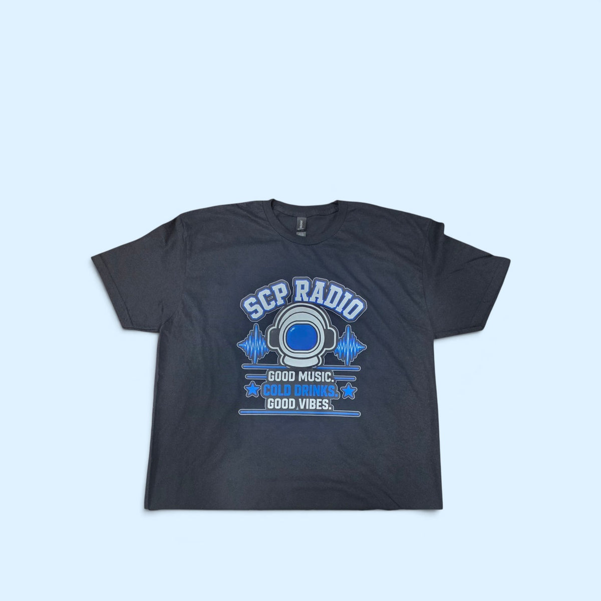 SCP Apparel black cotton crewneck t-shirt featuring a blue astronaut helmet and SCP Radio graphic print