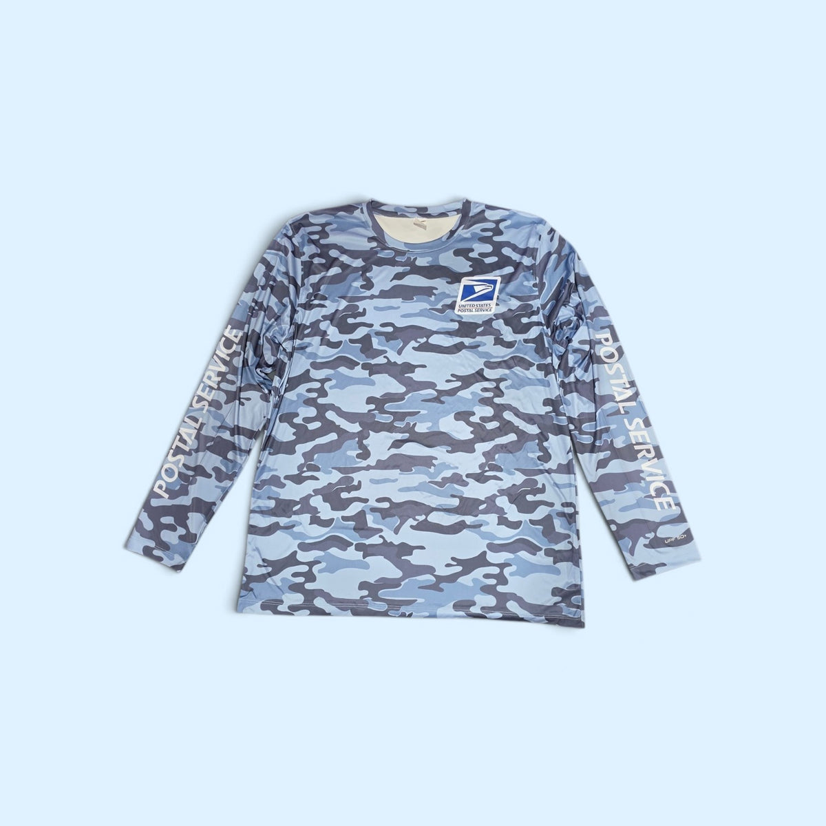SCP Apparel blue camouflage long sleeve performance shirt with official United States Postal Service logo and branding.