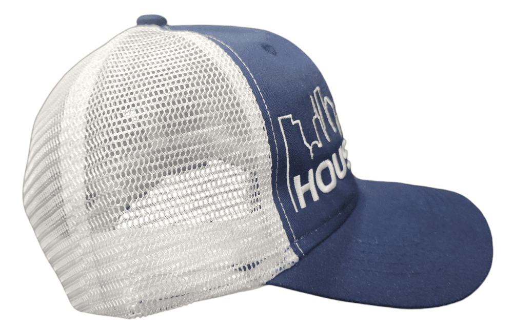 SCP Apparel navy blue and white mesh trucker hat with embroidered Houston skyline graphic and snapback closure