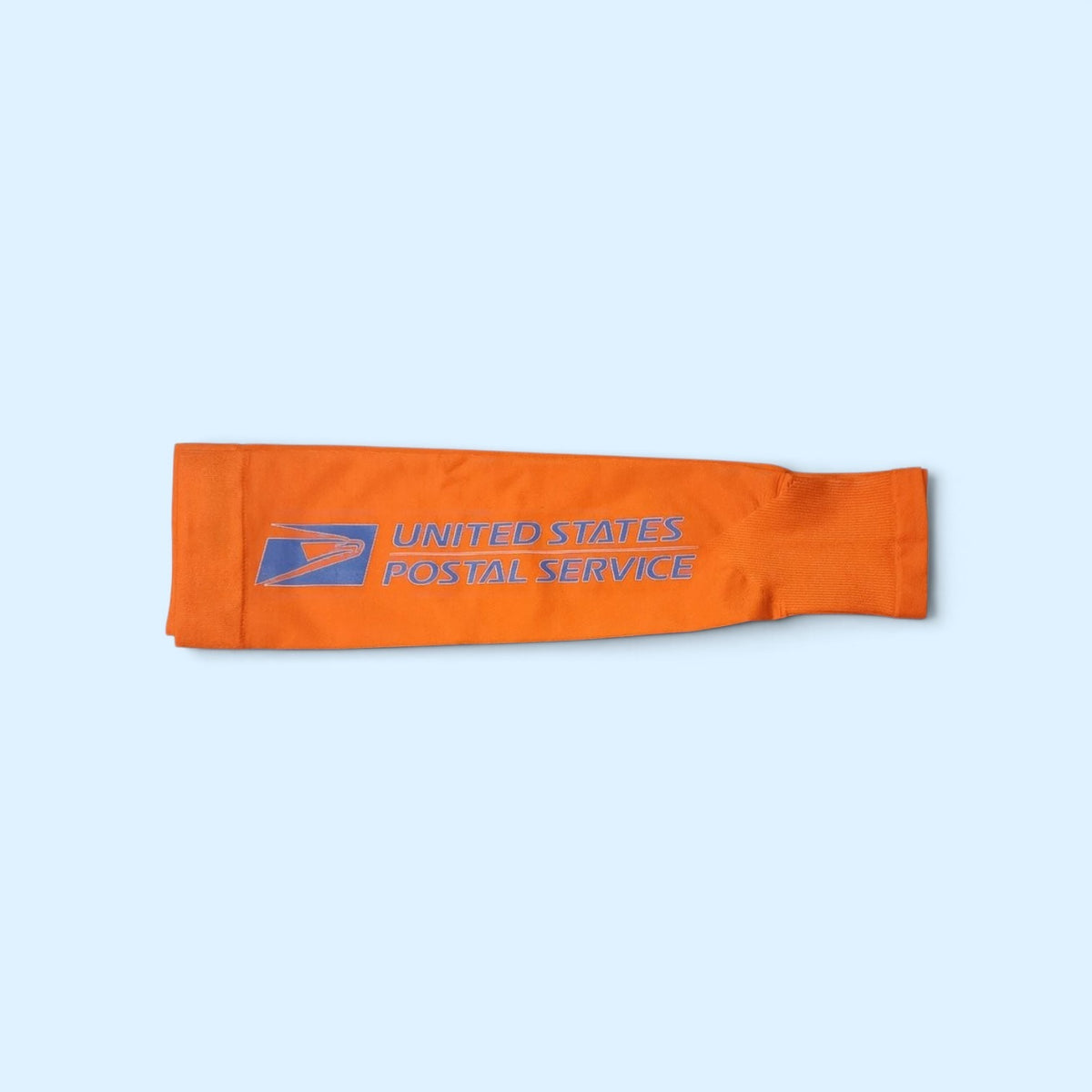 SCP Apparel orange athletic compression arm sleeve with United States Postal Service logo for outdoor work