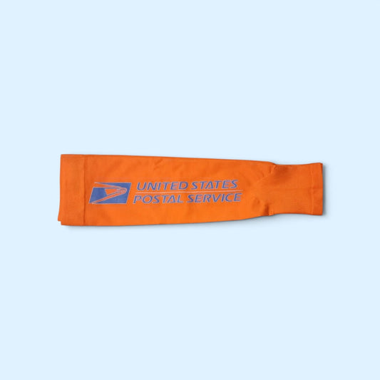 SCP Apparel orange athletic compression arm sleeve with United States Postal Service logo for outdoor work