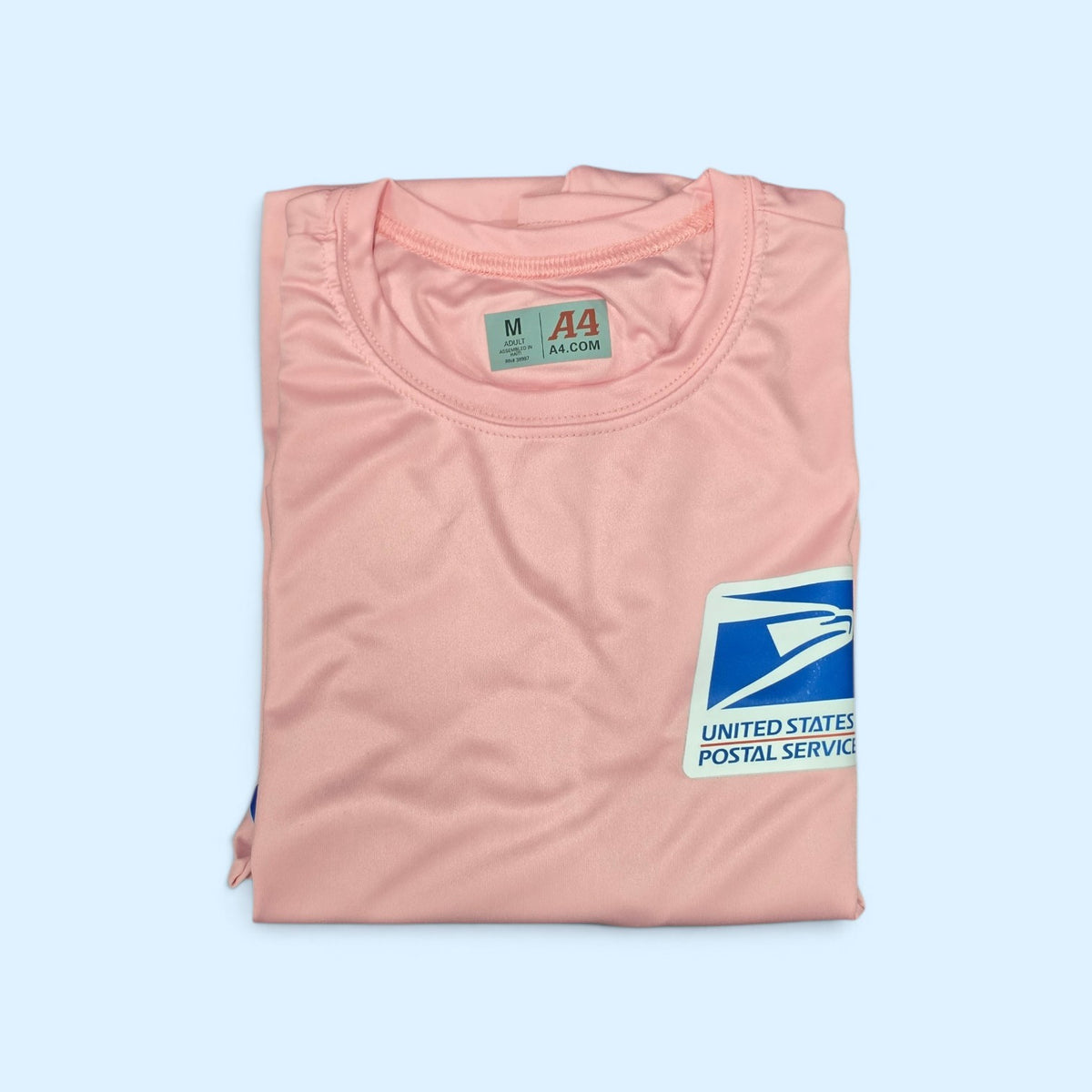 SCP Apparel pink long sleeve performance shirt with United States Postal Service logo on the chest