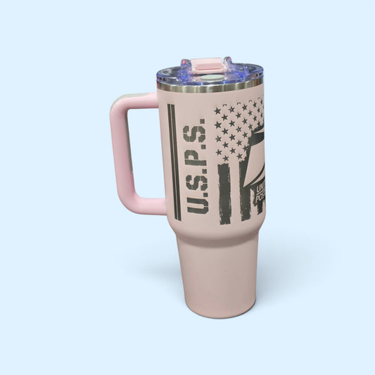 SCP Apparel 40-ounce pink stainless steel insulated tumbler with a black USPS flag graphic and ergonomic handle.