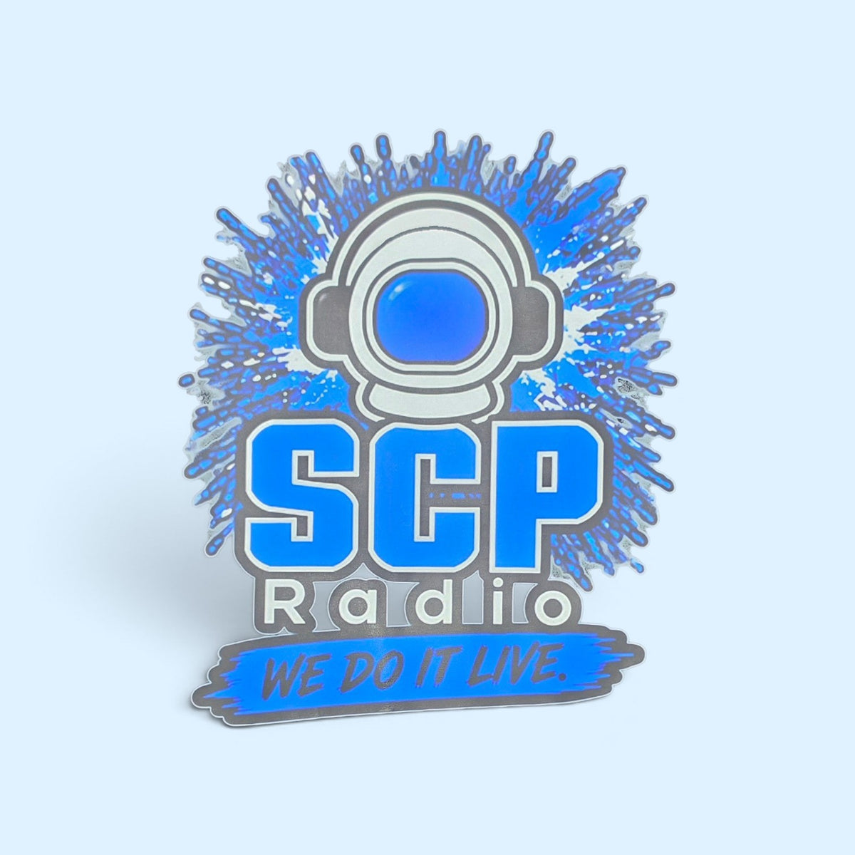 SCP Apparel SCP Radio graphic featuring an astronaut helmet with blue splash accents and the slogan We Do It Live