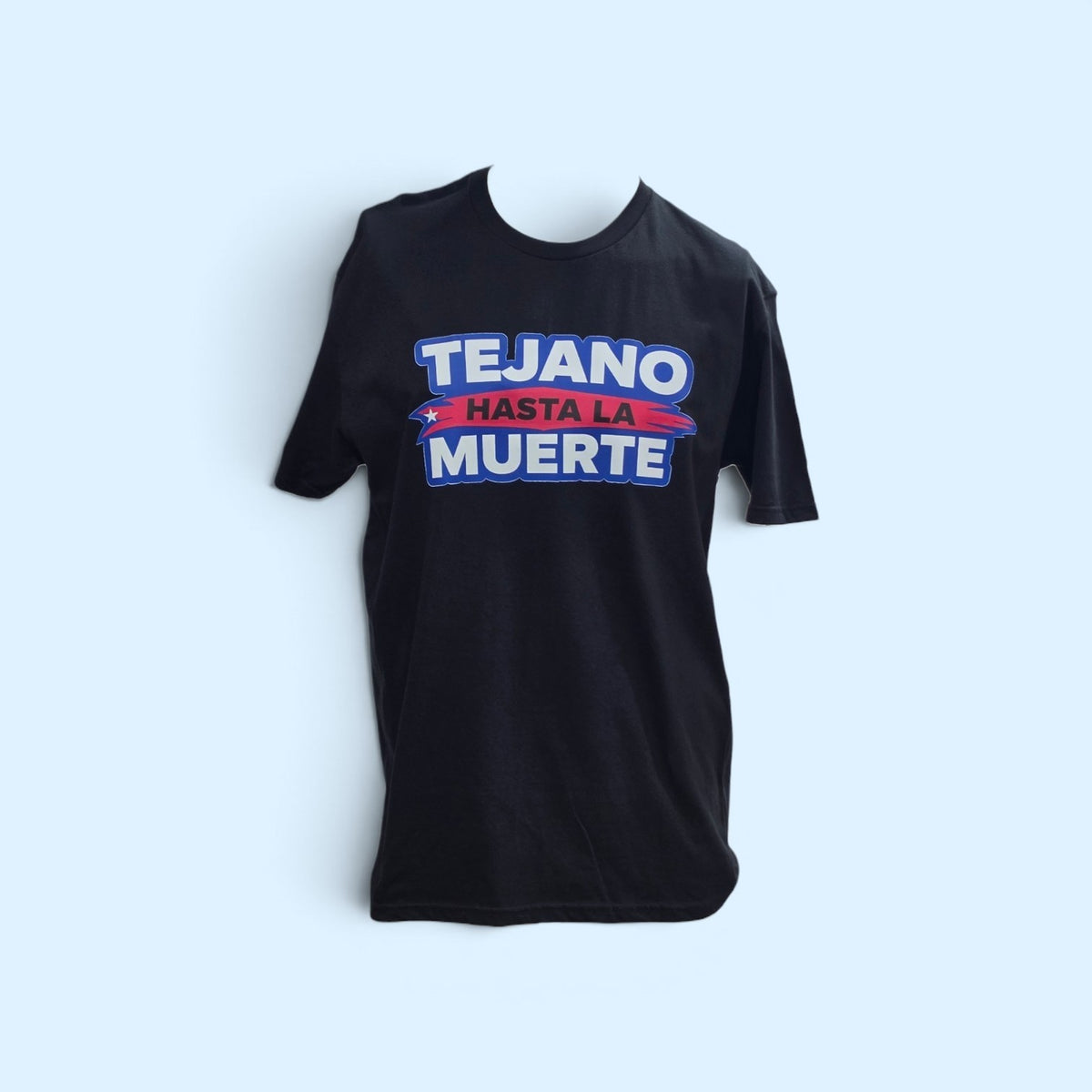 SCP Apparel black crewneck t-shirt featuring Tejano Hasta La Muerte graphic print in blue, white, and red lettering.