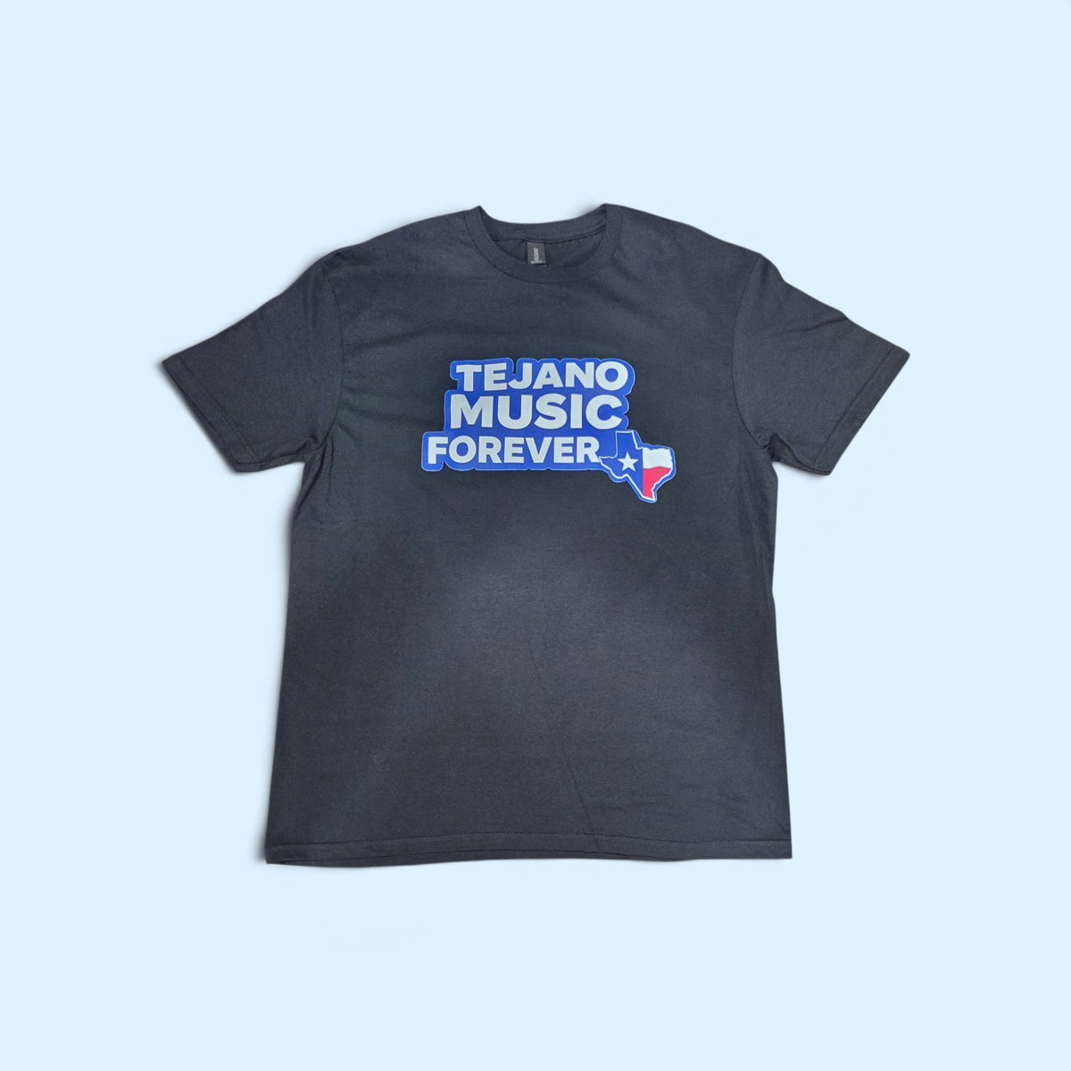 SCP Apparel black cotton crewneck t-shirt featuring a Tejano Music Forever graphic with a Texas state flag silhouette.