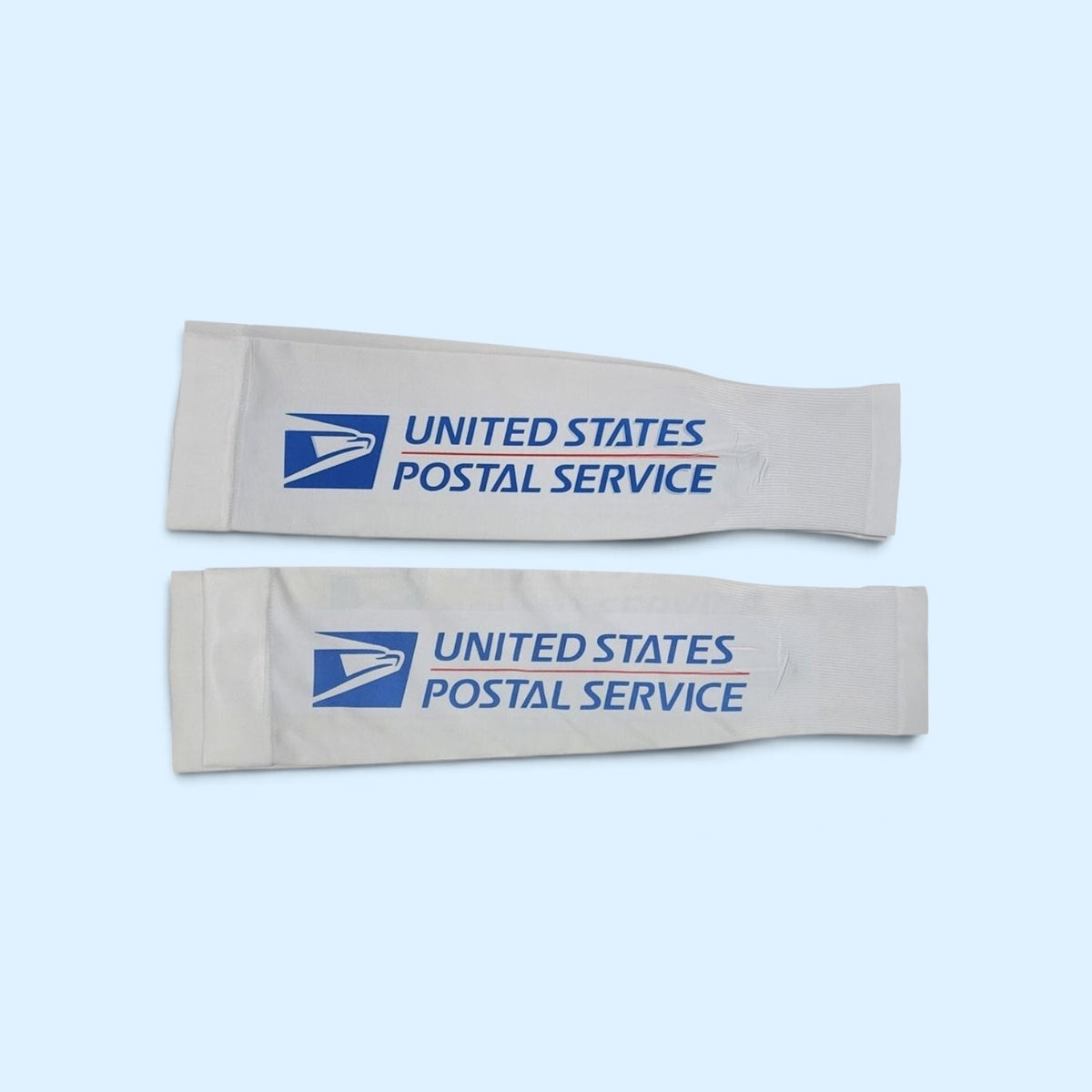 SCP Apparel white athletic arm compression sleeves with blue United States Postal Service logo